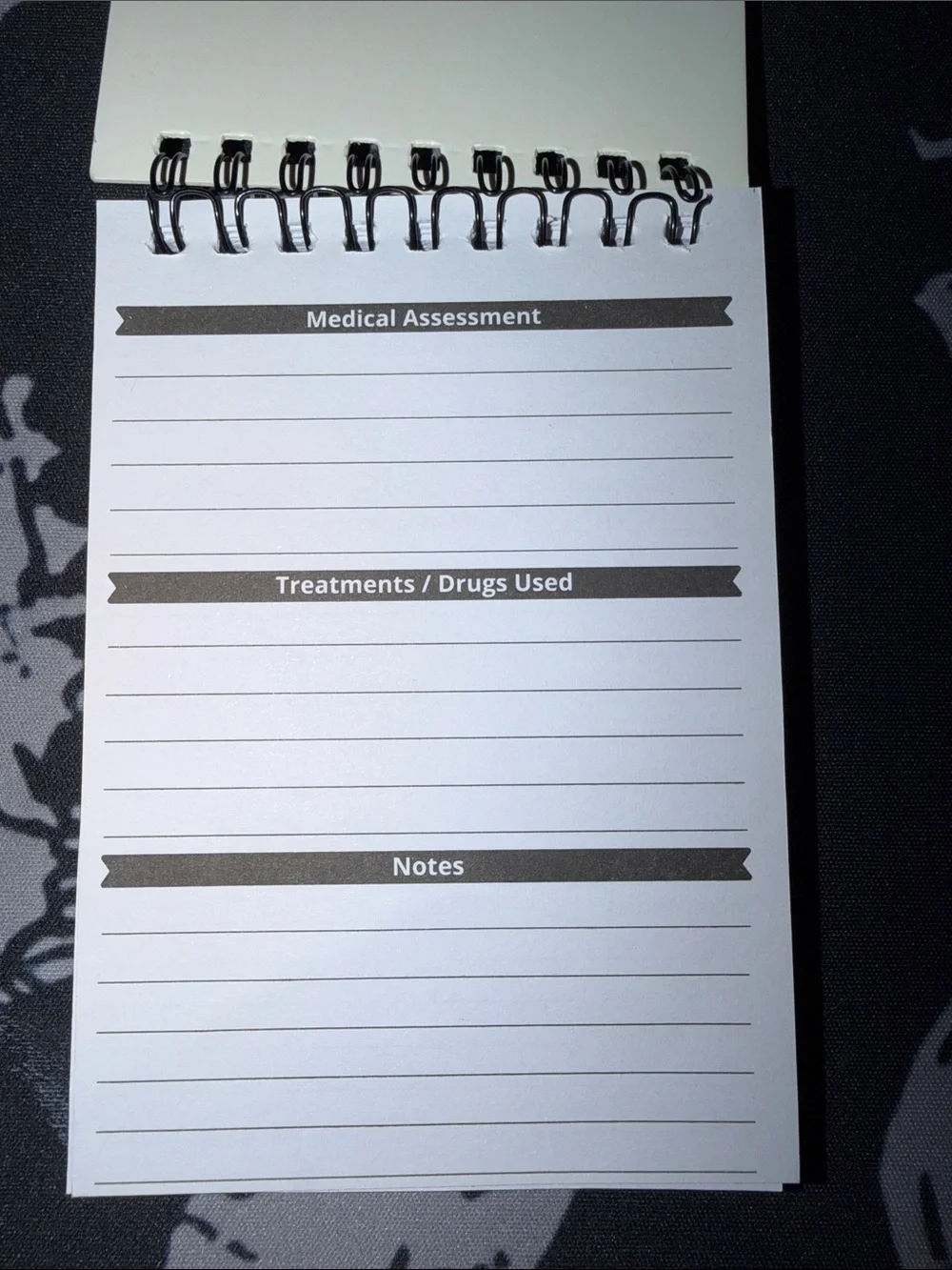 Red Spiral Medical Patient Assessment pocketbook